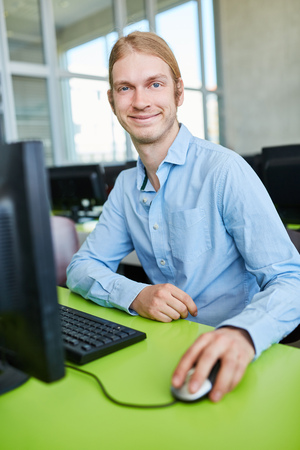 Student as computer nerd and developer in IT university courseの写真素材