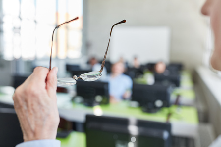 Glasses of teacher or lecturer with competence in university seminarの写真素材