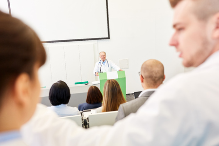 University students in medicine apprenticeship lecture with physicianの写真素材