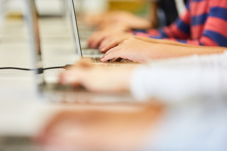 Students learn computer science on laptop computer in netの写真素材