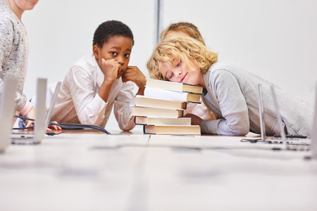 Group of kids does homework together in a primary school study groupの写真素材