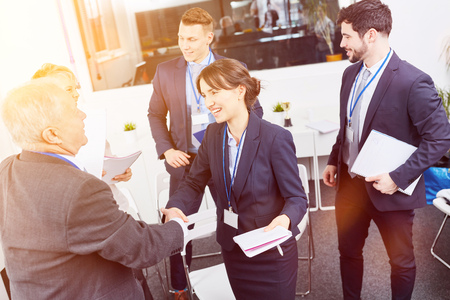Business people shake hands after workshop as thank you signの写真素材