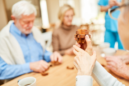 Puzzle or puzzle wooden building blocks for seniors as employmentの写真素材