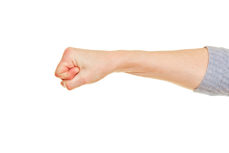 Clenched female fist isolated against a white backgroundの写真素材