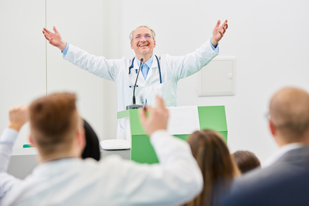 Physician with enthusiasm as happy lecturer after successful medicine seminarの写真素材