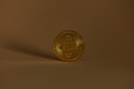 Bitcoin currency as a coin against a dark background