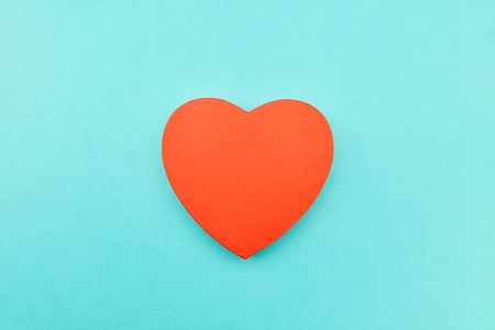 Red heart as a love concept on a blue backgroundの写真素材