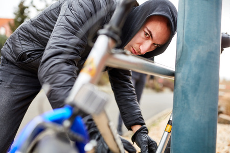 Teenager completes his bike in the cityの写真素材