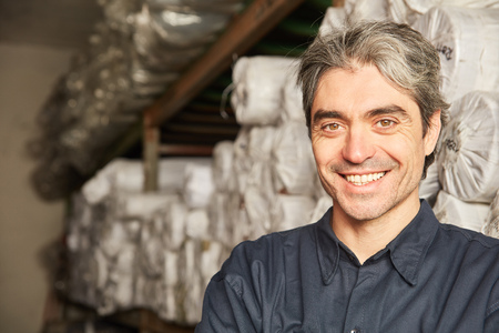 Man as a warehouse logistics or warehouse specialist in the warehouseの写真素材