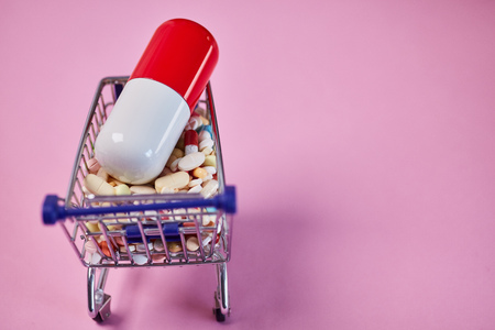 Many medicines as mail order pharmacy concept in shopping cartの写真素材