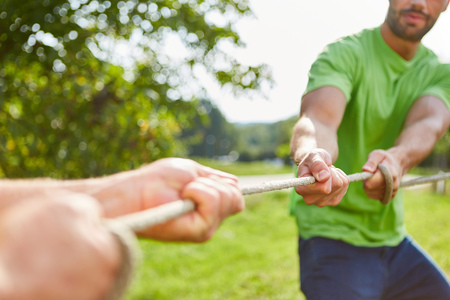Competition in tug of war at a sports festival or a teambuilding eventの写真素材