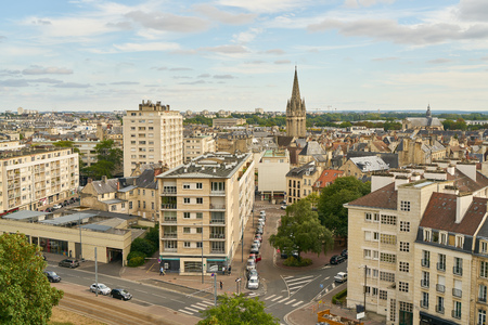 City skyline Caen with houses in France under a sky with cloudsの写真素材