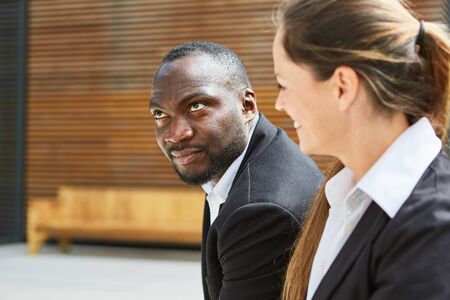 African business man and a colleague in an international teamの写真素材