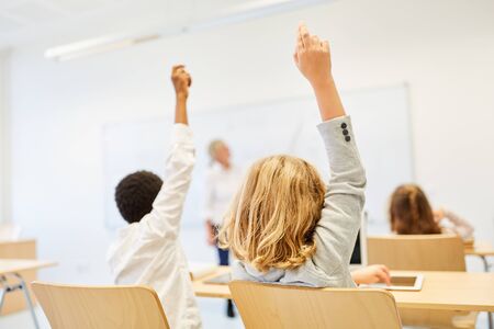 Pupils in elementary school in class report and want to answerの写真素材