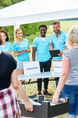 Volunteers as volunteers collect donations for a non-profit organizationの写真素材