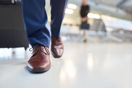 Brown elegant leather shoes with laces of a businessman travelingの写真素材