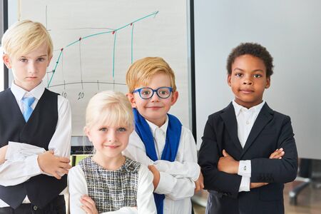 Group of multicultural children as a successful and confident business teamの写真素材