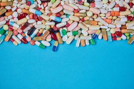 Colorful drugs on the edge as background with copy space