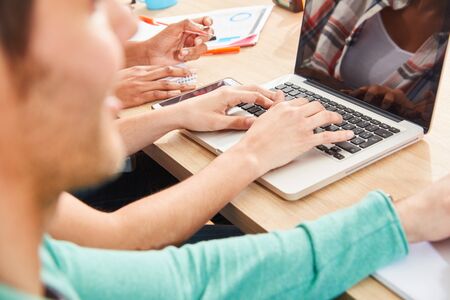 Business people in e-learning or in a computer training at the laptop