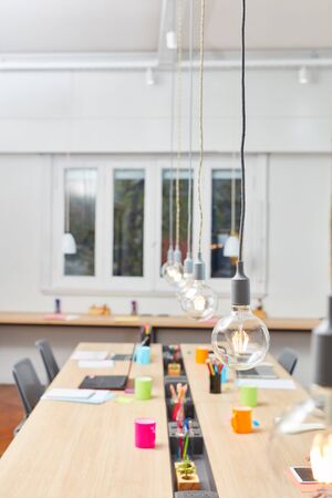 Large office with multiple jobs in a co-working business start-up