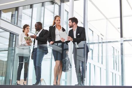 Successful business team talking in the modern officeの写真素材