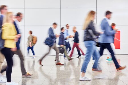 Anonymous Crowd People go back and forth in trade fair or mall