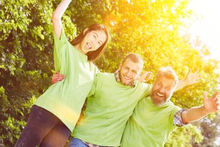 Volunteer environmentalists as a team in summer in nature
