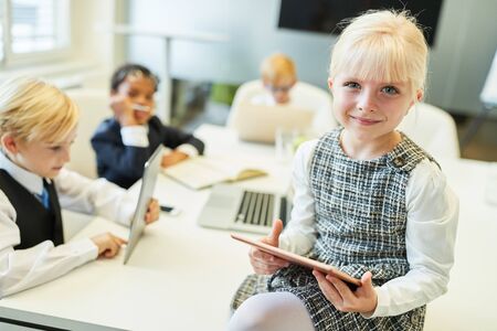 Girl as teacher or lecturer in a computer course or meeting