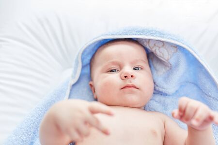 Newborn cute baby looks alert and awake