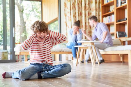 Parents argue about separation and divorce in front of their screaming childの写真素材