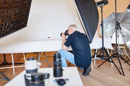 Photographer as an advertising photographer in the photo studio when photographing foodの写真素材