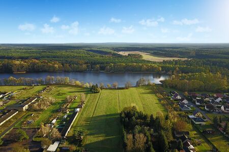 Green landscape with lake at the village in summer in Kagel, Germany