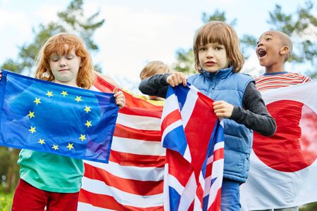 Group of kids in international kindergarten with different flagsの写真素材