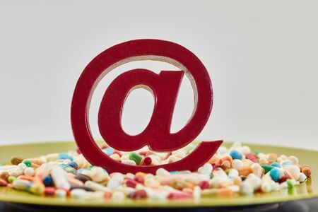 Mail order pharmacy on the internet with medication and email symbolの写真素材