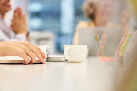 A cup of coffee on the conference table in a business meeting or seminar