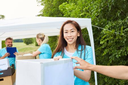 Young volunteer woman helps raise money in her social year