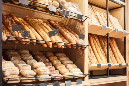 Fresh breads and baguettes and bread rolls in a bakery