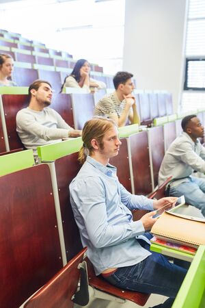 Students in university lecture learn together