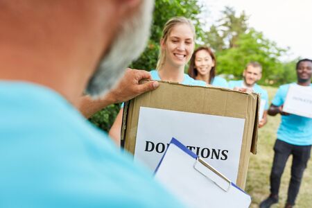 Volunteers contribute donations to register with a fundraiserの写真素材