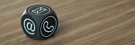 Hotline support contact on cube on wooden table (3D Rendering)の写真素材