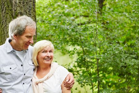 Couple in love seniors stands happily in natureの写真素材
