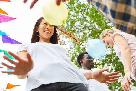 Young asian woman at a balloon dance on a summer party or workshopの写真素材