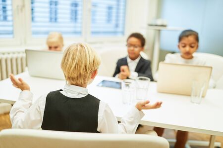 Children as business people and job applicants in a job interviewの写真素材
