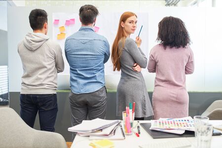 Business woman with colleagues in creative brainstorming workshop for equality