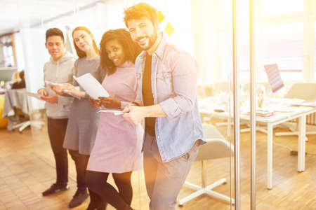 Startup business team laughing together in the office