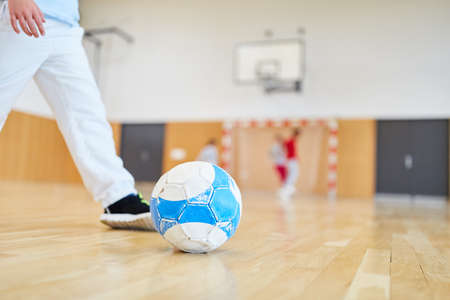 Kids in football. Training in the gym of elementary schoolの写真素材