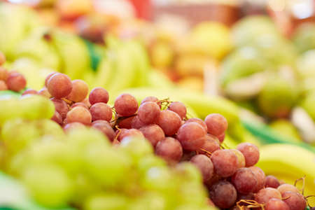 Red grapes are for sale in the supermarketの写真素材