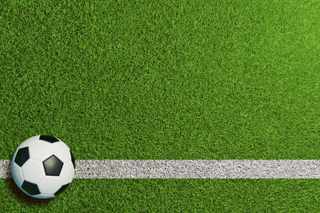 Football lying and waiting right on the side line on a green lawn (3D rendering)