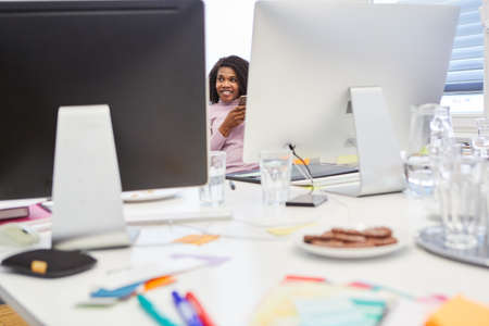 African business woman in internet agency office with computers on table