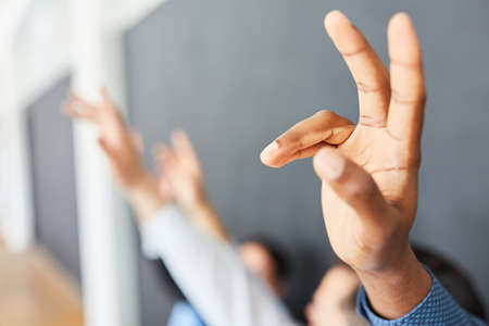 Hands of students or business people in a seminar or workshopの写真素材
